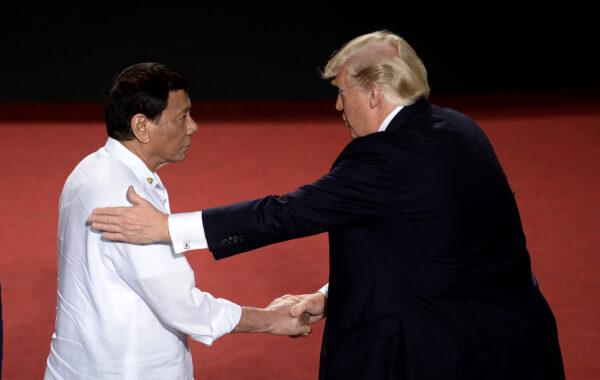 Philippine President Rodrigo Duterte shakes hands with U.S. President Donald Trump (R) during the 31st ASEAN Summit in Cultural Center of the Philippines in Manila, Philippines, on Nov. 13, 2017. (Noel Celis/AFP via Getty Images)