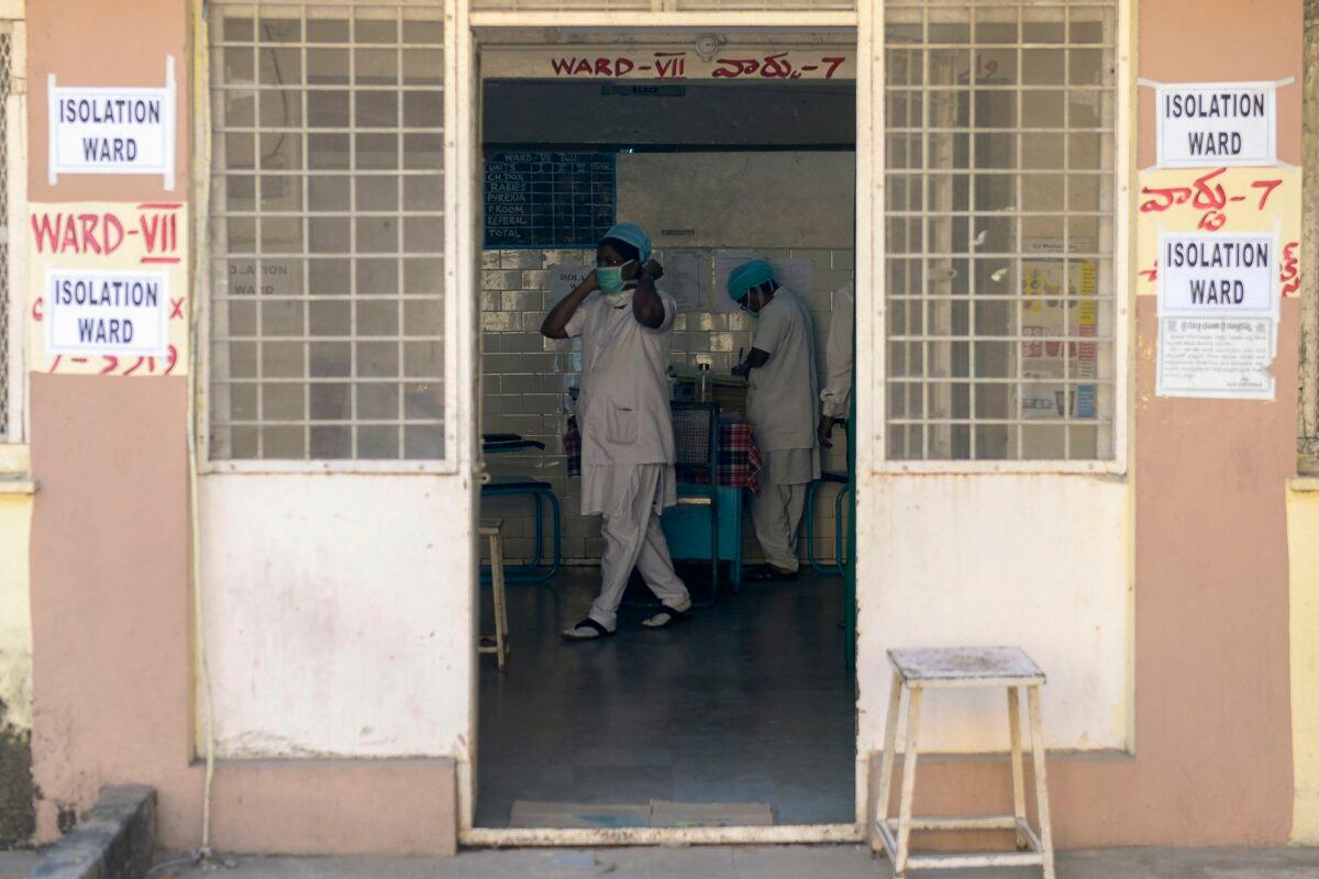 Nurses are seen inside an isolation ward as patients coming from Hong Kong requested medical checks as a preventative measure following a coronavirus outbreak which began in the Chinese city of Wuhan, at a government run Fever Hospital in Hyderabad, on Jan. 27, 2020. (Noah Seelam/AFP via Getty Images)