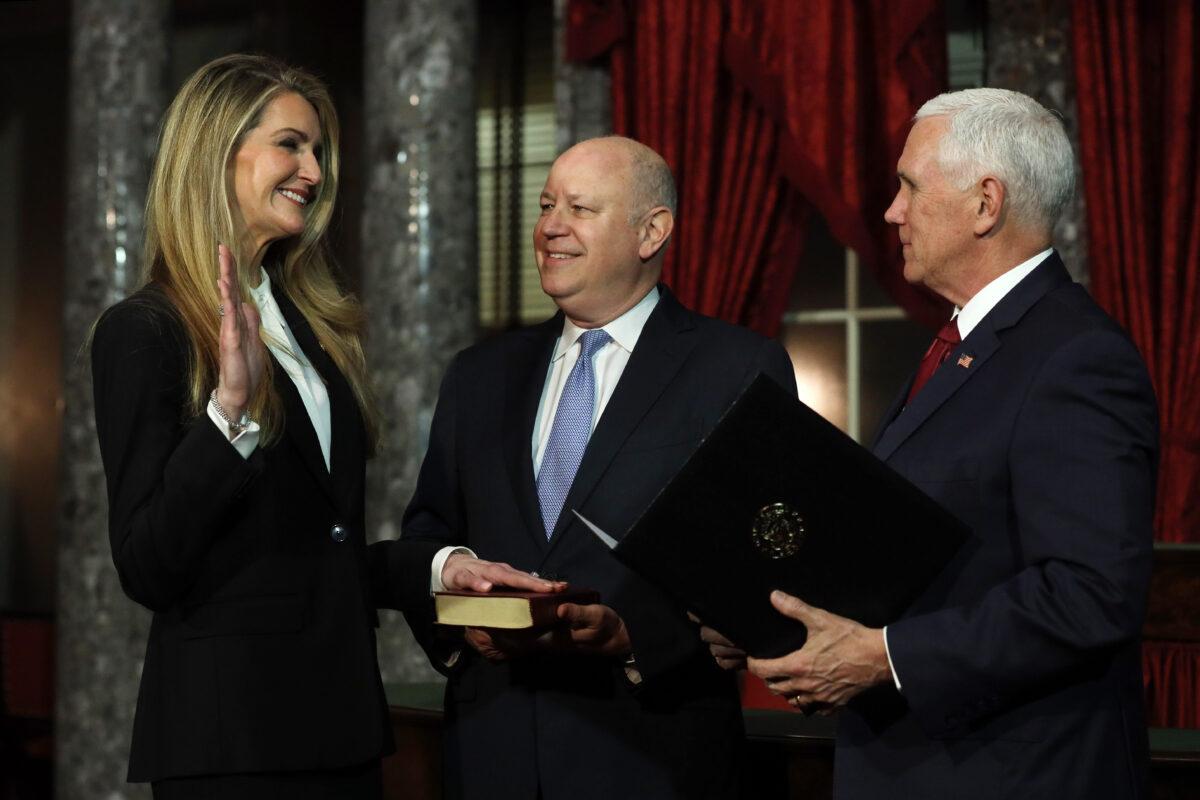 Sen. Kelly Loeffler (R-Ga.) and Vice President Mike Pence participate in a ceremonial swearing-in as Loeffler’s husband Jeff Sprecher looks on at the Old Senate Chamber of the U.S. Capitol in Washington on Jan. 6, 2020. (Alex Wong/Getty Images)