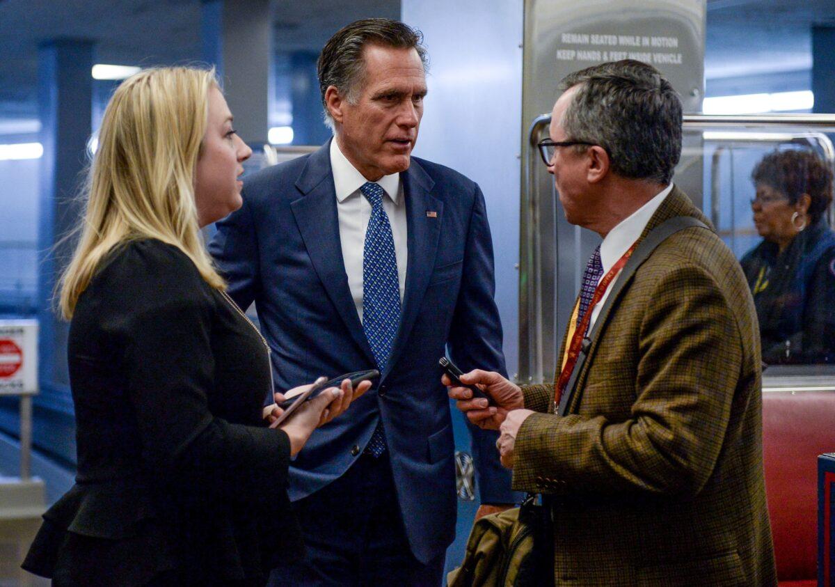 Sen. Mitt Romney (R-Utah), a potential swing vote for witnesses, speaks as he walks through the Senate subway on his way to the Senate impeachment trial of President Donald Trump in Washington on Jan. 29, 2020. (Mary F. Calvert/Reuters)