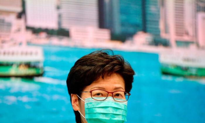 Hong Kong Leader Rejects Calls to Close Border Despite Virus Fears