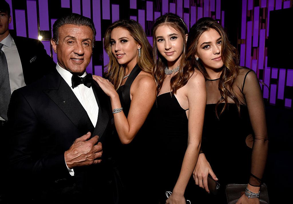 (L–R) Stallone with his daughters Sophia, Scarlet, and Sistine at the 2017 InStyle and Warner Bros. 73rd Annual Golden Globe Awards afterparty in Beverly Hills, California, on Jan. 8, 2017 (©Getty Images | <a href="https://www.gettyimages.com/detail/news-photo/actor-sylvester-stallone-scarlet-rose-stallone-sophia-rose-news-photo/631291644?adppopup=true">Matt Winkelmeyer</a>)