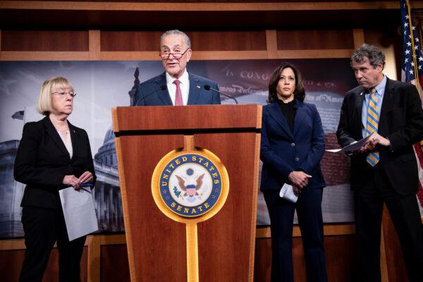 Sen. Chuck Schumer (D-N.Y.), second from left, speaks as Sens. Patty Murray (D-Wash.), Kamala Harris (D-Calif.), and Sherrod Brown (D-Ohio) listen in a press conference in Washington on Jan. 31, 2020. (Brendan Smialowski/AFP via Getty Images)
