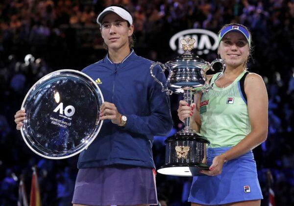 Sofia Kenin, right, of the U.S. holds the Daphne Akhurst Memorial Cup after defeating Spain's Garbine Muguruza in the women's singles final at the Australian Open tennis championship in Melbourne, Australia on Feb. 1, 2020. (Lee Jin-man/AP Photo)