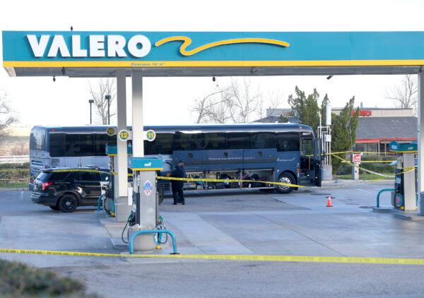 Investigators are seen outside of a Greyhound bus after a passenger was killed on board in Lebec, Calif., on Feb. 3, 2020. (Jayne Kamin-Oncea/AP Photo)