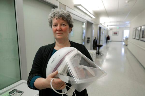 Robin Addison, a nurse in the Emergency Department at Providence Regional Medical Center, with a protective helmet and face shield in Everett, Wash., on Jan. 23, 2020. (Ted S. Warren/AP)