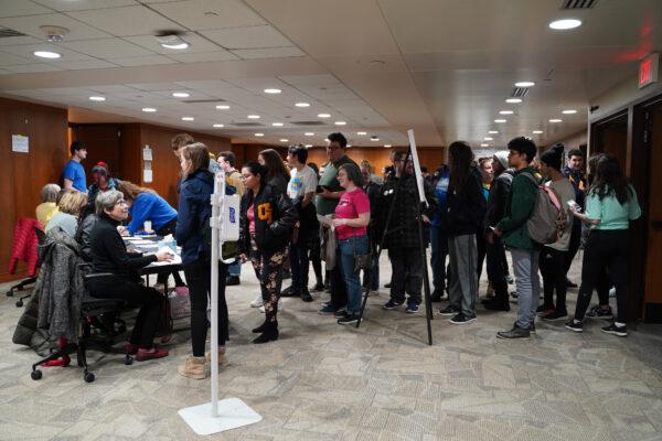 Students at the University of Iowa wait to sign up for the precinct 5 caucus at the Iowa Memorial Union on campus, Feb. 3, 2020. (Cara Ding/The Epoch Times)