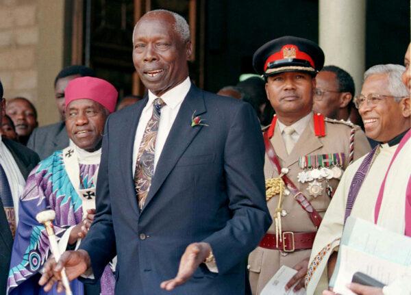 Kenyan President Daniel arap Moi shares a joke with the clergy of the Holy Family Basilica where he attended a memorial service for Kenya's first president Jomo Kenyatta, on Aug. 22, 1997. (George Mulala/File Photo/Reuters)