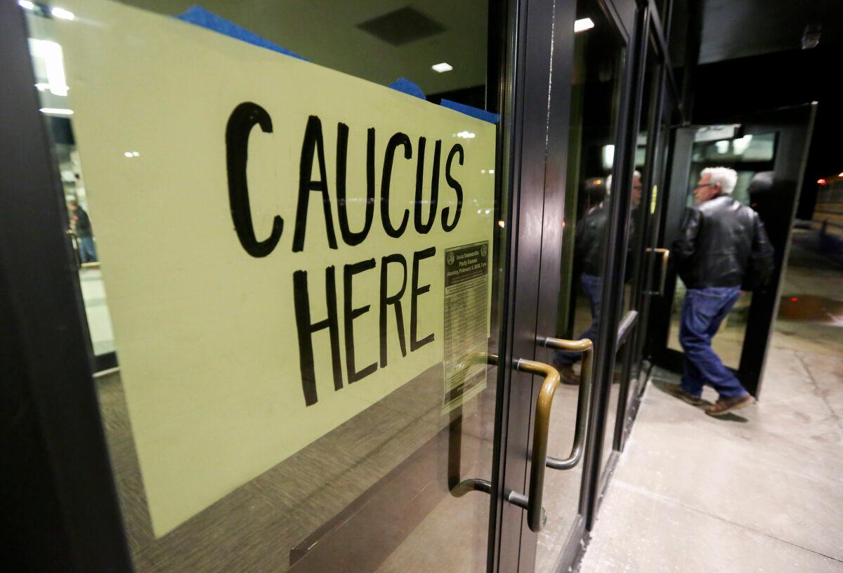 People enter a caucus in Dubuque, Iowa, on Feb. 3, 2020. (Nicki Kohl/Telegraph Herald via AP)
