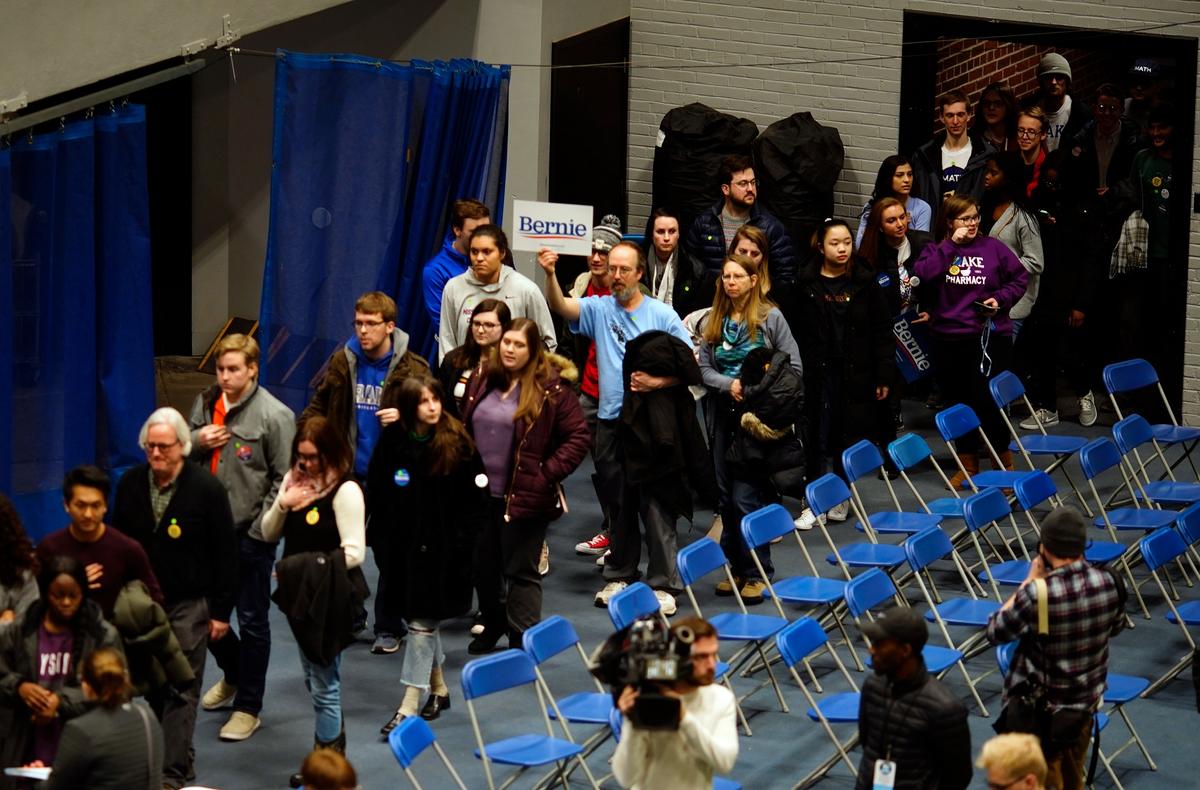 People enter a caucus at Drake University in Des Moines, Iowa, on Feb. 3, 2020. (Eric Thayer/Reuters)