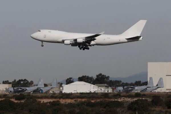 A plane carrying evacuees from the virus zone in China lands at Marine Corps Air Station Miramar in San Diego, Calif., on Feb. 5, 2020. (Gregory Bull/AP Photo)