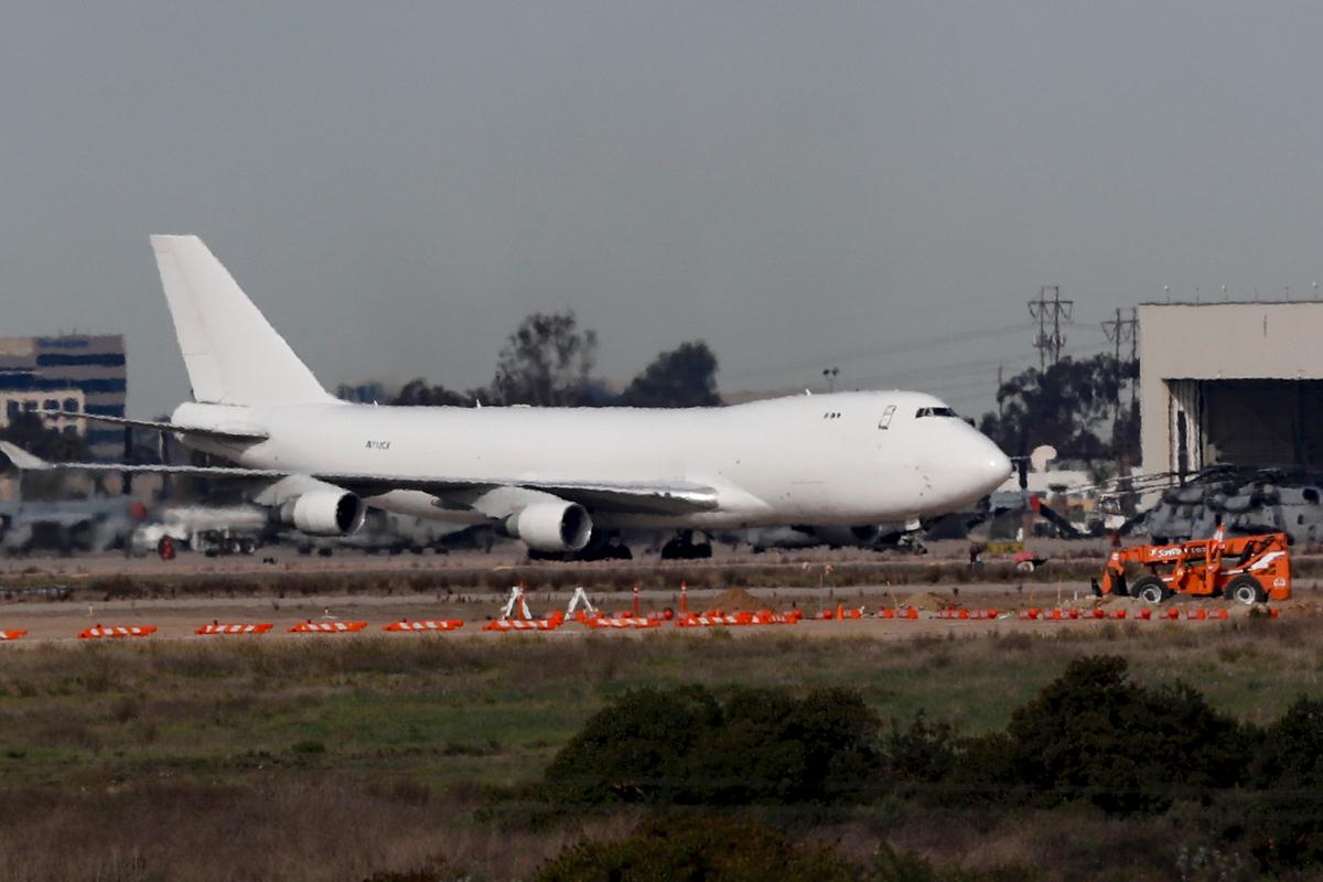 A plane carrying evacuees from the virus zone in China lands at Marine Corps Air Station Miramar in San Diego, Calif., on Feb. 5, 2020. (Gregory Bull/AP Photo)