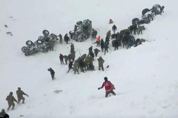 Turkish soldiers and locals try to rescue people trapped under avalanche in Bahcesaray in Van province, Turkey, on Feb. 5, 2020.( Ihlas News Agency (IHA) via Reuters)