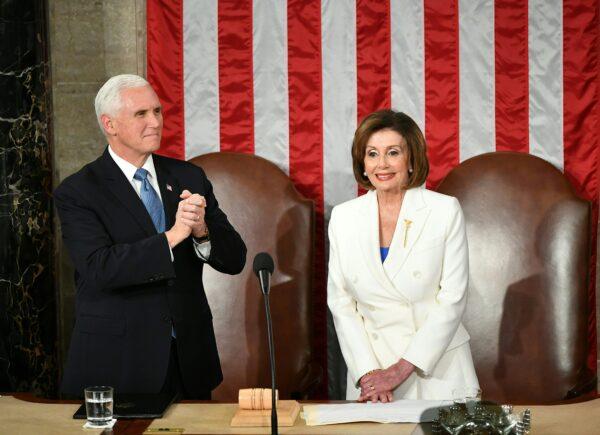 Vice President Mike Pence and Speaker of the House Nancy Pelosi are seen at their seats before President Donald Trump's State of the Union address at the U.S. Capitol in Washington, on Feb. 4, 2020. (Mandel Ngan/AFP via Getty Images)
