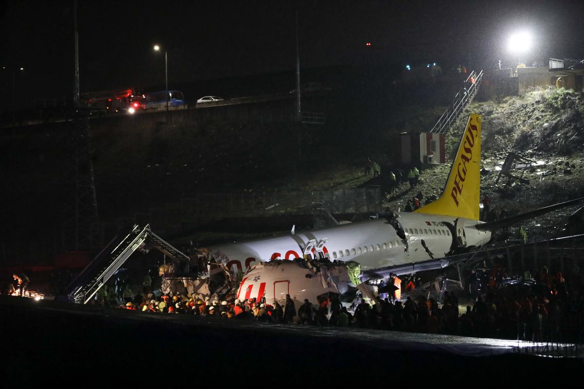 Rescuers work to extract passengers from the crash at Istanbul's Sabiha Gokcen airport in Turkey on Feb. 5, 2020. (STR/AFP via Getty Images)