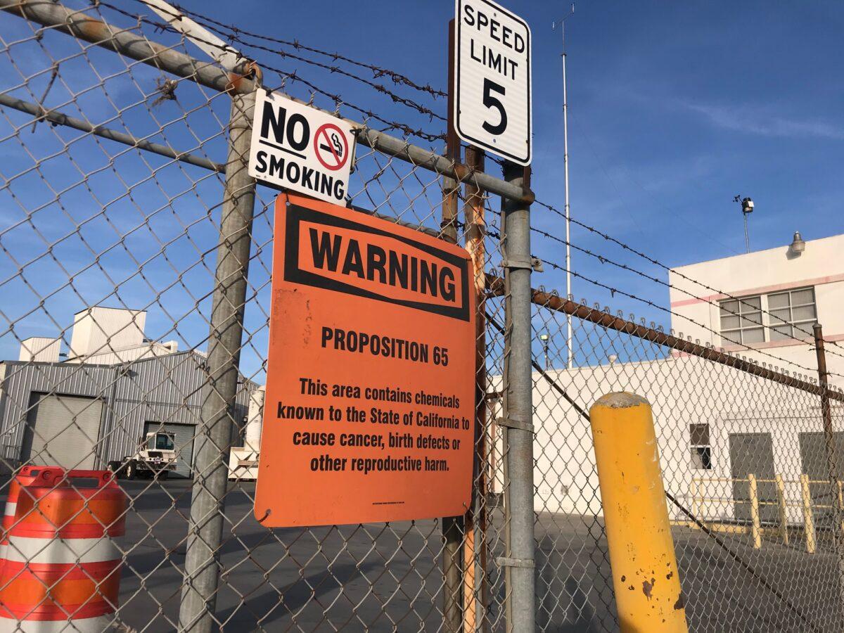A sign outside a shuttered Exide Technologies battery recycling plant in Commerce, Calif., on Jan. 31, 2020. The plant was the source of lead and arsenic pollution covering neighborhoods in the surrounding 1.7 miles. (Chris Karr/The Epoch Times)