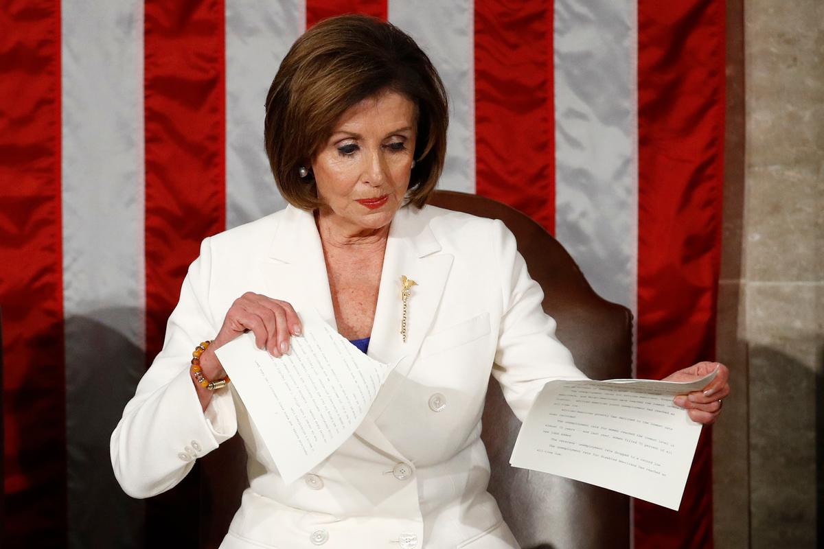 House Speaker Nancy Pelosi (D-Calif.) tears her copy of President Donald Trump's State of the Union address after he delivered it to a joint session of Congress on Capitol Hill in Washington on Feb. 4, 2020. (Patrick Semansky/AP Photo)