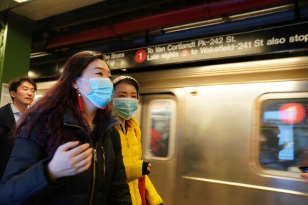 People wear surgical masks in the subway station at Times Square in New York on Jan. 31, 2020. (Bryan R Smith/Reuters)
