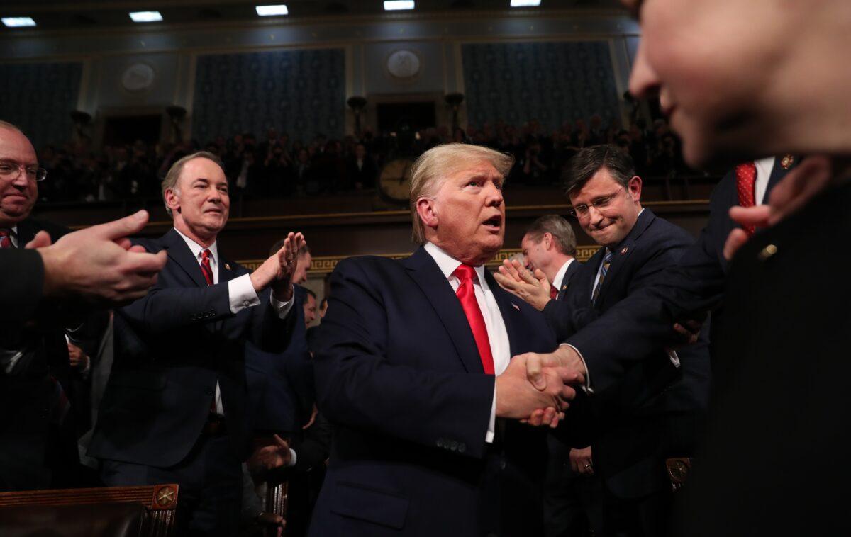 President Donald Trump arrives to deliver the State of the Union address in the House chamber on Feb. 4, 2020. Trump delivered his third State of the Union address on the night before the U.S. Senate is set to vote on his impeachment trial. (Leah Millis/Pool/Getty Images)