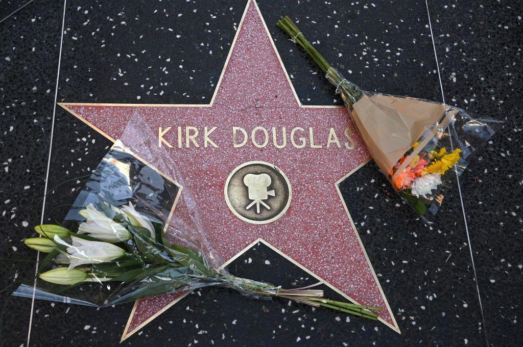 Flowers placed on the star of late actor Kirk Douglas on the Walk of Fame in Hollywood, California, on Feb. 5, 2020 (©Getty Images | <a href="https://www.gettyimages.com/detail/news-photo/flowers-are-placed-on-the-star-of-late-actor-kirk-douglas-news-photo/1198875097">ROBYN BECK/AFP</a>)