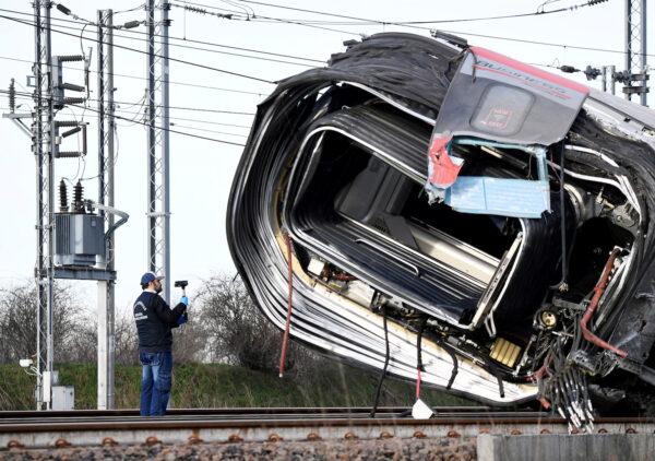 An emergency personnel works after a high-speed train traveling from Milan to Bologna derailed, killing at least two people near Lodi, Italy, on Feb. 6, 2020. (Flavio Lo Scalzo/Reuters)