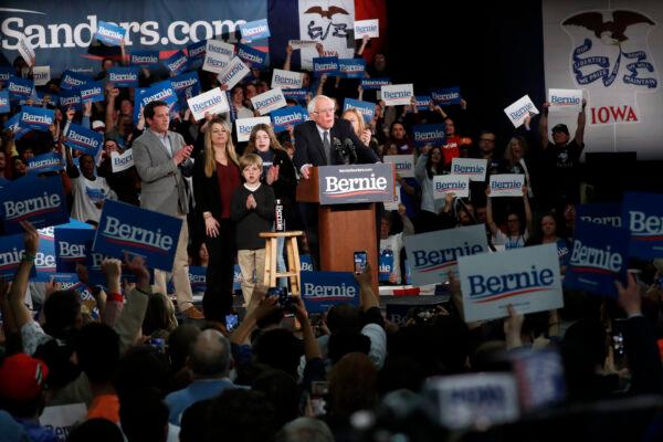 Democratic presidential candidate Sen. Bernie Sanders (I-Vt.) accompanied by his family, speaks to supporters at a caucus night campaign rally in Des Moines, Iowa, on Feb. 3, 2020. (Pablo Martinez Monsivais/AP Photo)