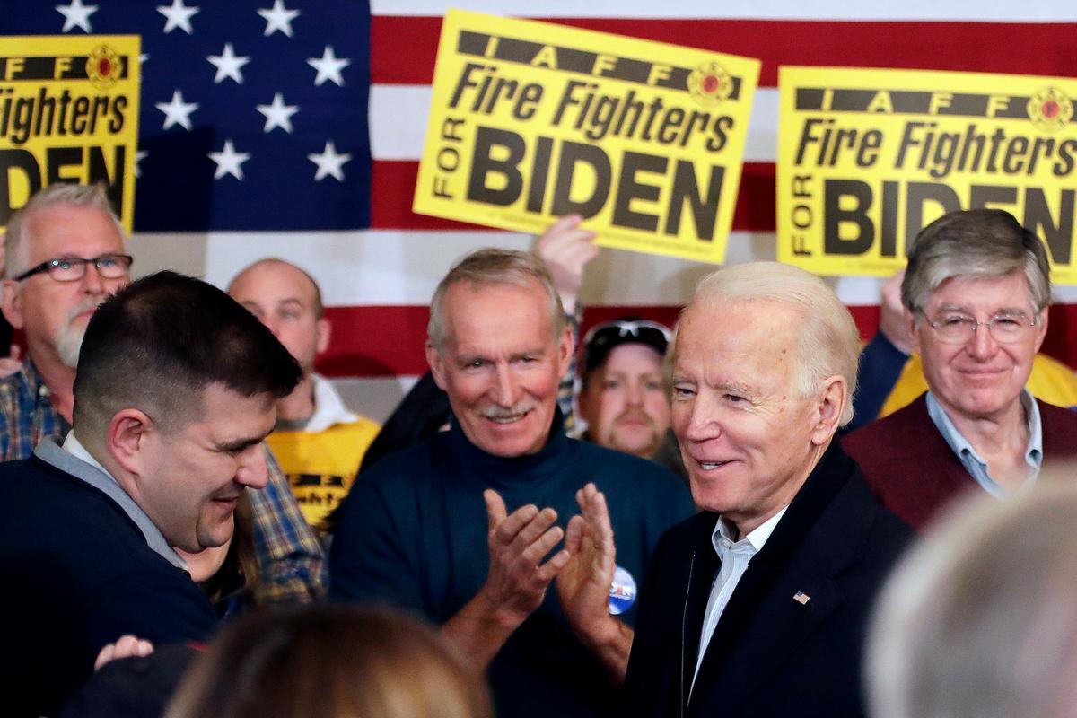 Democratic presidential candidate former Vice President Joe Biden greets people at a campaign event in Somersworth, New Hampshire, on Feb. 5, 2020. (Elise Amendola/AP Photo)