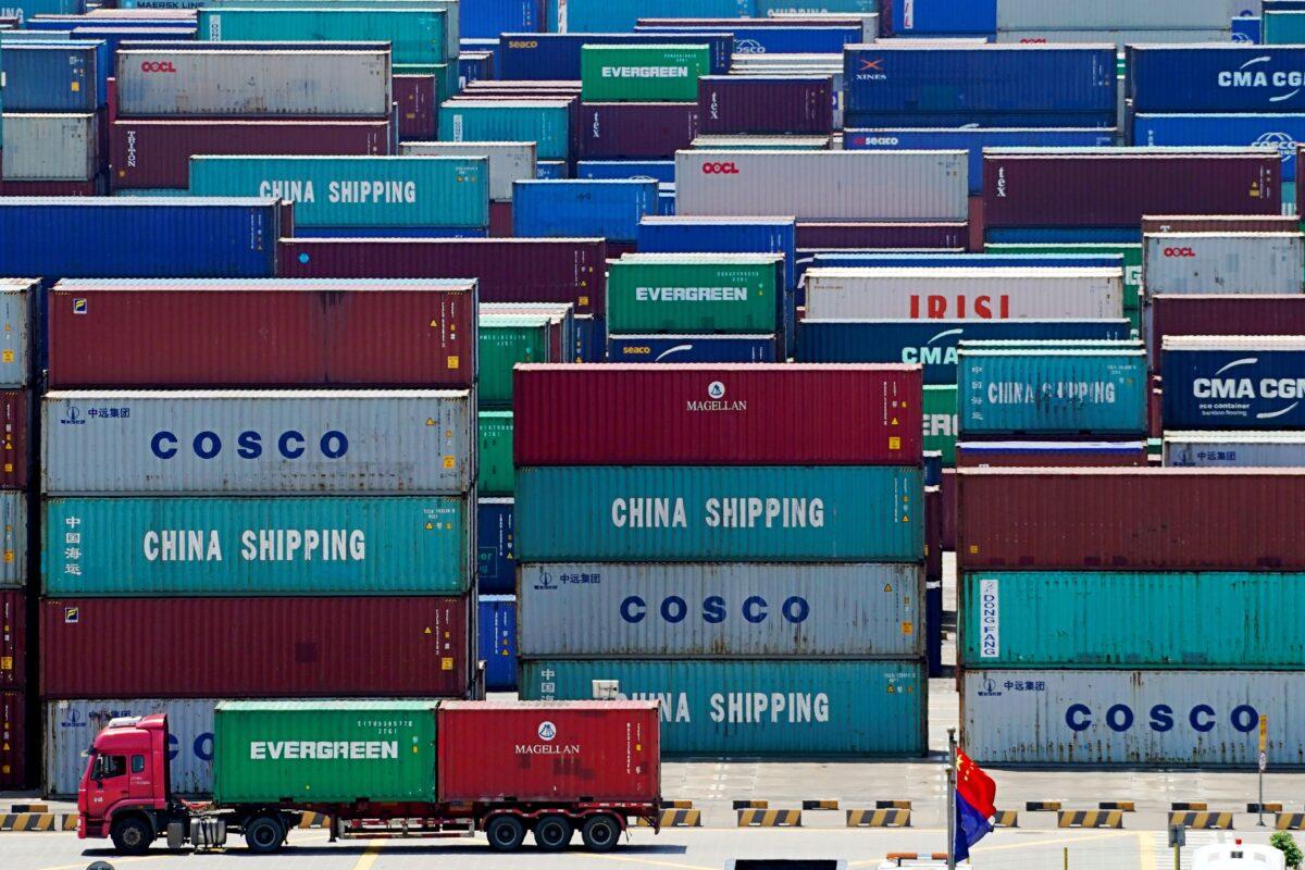 A truck carrying containers at the Yangshan Deep Water Port in Shanghai, China on Aug. 6, 2019. (Aly Song/Reuters)