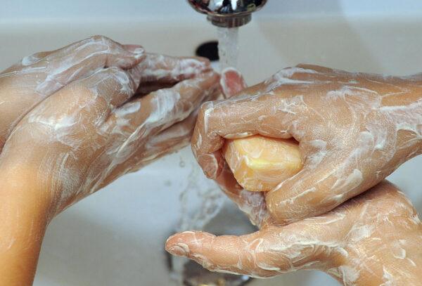 Children wash their hands with soap in this file photo. Washing hands is advised to curb the spread of infectious diseases. (Thomas Lohnes/DDP/AFP via Getty Images)