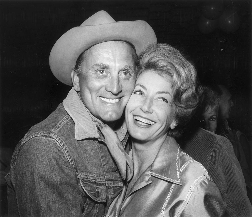 Douglas and his wife, Anne, at the eighth annual Share Inc. 'Boomtown Party' for the Exceptional Children's Foundation on May 21, 1962 (©Getty Images | <a href="https://www.gettyimages.com/detail/news-photo/american-actor-kirk-douglas-and-his-wife-anne-at-the-eighth-news-photo/3241915?adppopup=true">Nat Dallinger</a>)