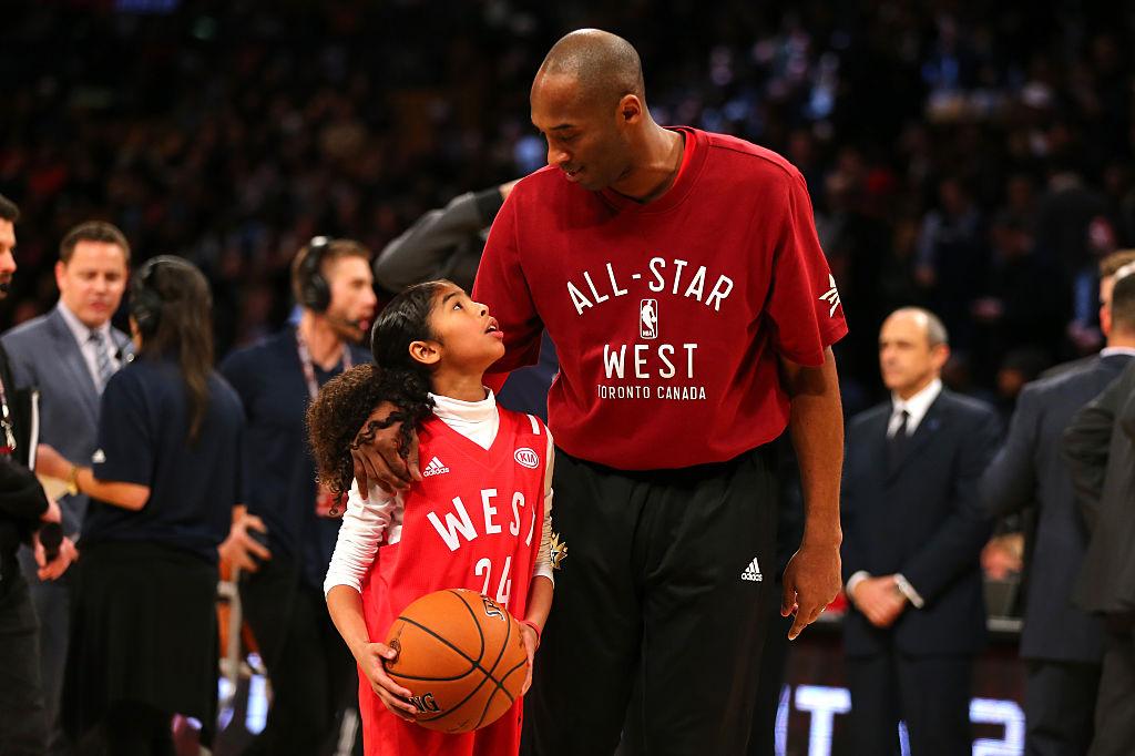 Bryant warms up with daughter Gianna during the NBA All-Star Game at the Air Canada Center in Toronto, Ontario, on Feb. 14, 2016. (©Getty Images | <a href="https://www.gettyimages.com/detail/news-photo/kobe-bryant-of-the-los-angeles-lakers-and-the-western-news-photo/510291022?adppopup=true">Elsa</a>)