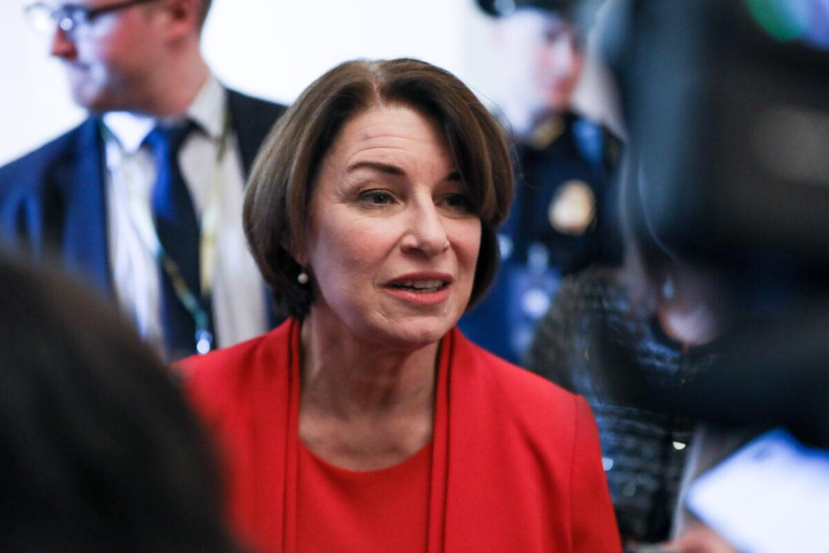 Sen. Amy Klobuchar (D-Minn.) talks to media during a break in the closing arguments of the impeachment trial of President Donald Trump in Washington on Feb. 3, 2020. (Charlotte Cuthbertson/The Epoch Times)