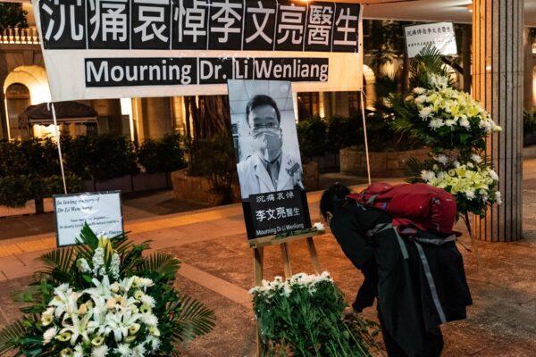 People attend a site in Hong Kong on Feb. 7, 2020, set up to mourn the passing of doctor Li Wenliang, who tried to warn people about COVID-19 and later died of the disease. (Anthony Kwan/Getty Images)
