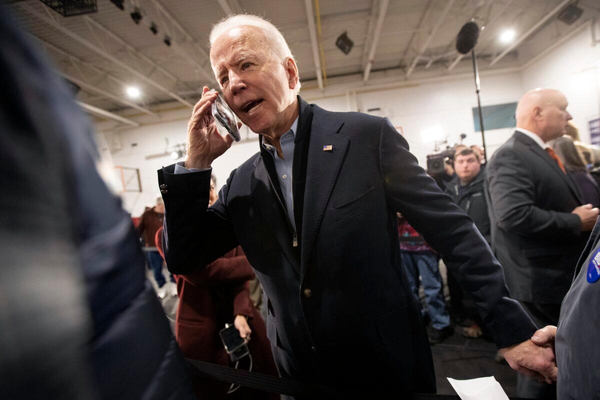 Democratic presidential candidate former Vice President Joe Biden wishes Barbara Moroney, of Rocky Point, N.Y., a happy 80th birthday on the phone during a campaign rally in Nashua, N.H. on Feb. 4, 2020. (Mary Altaffer/AP Photo)