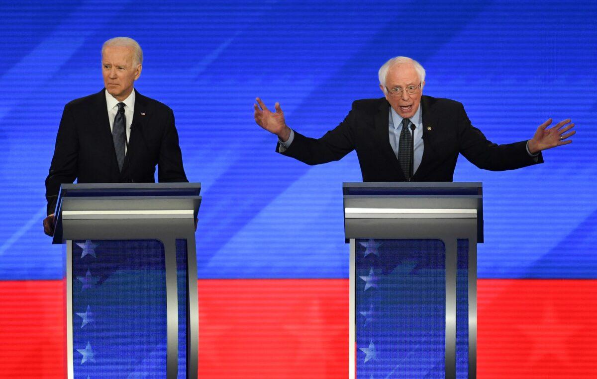 Democratic presidential hopeful former Vice President Joe Biden, left, and Sen. Bernie Sanders (I-Vt.) during the eighth Democratic primary debate of the 2020 presidential campaign season at St. Anselm College in Manchester, New Hampshire on Feb. 7, 2020. (Timothy A. Clary/AFP via Getty Images)