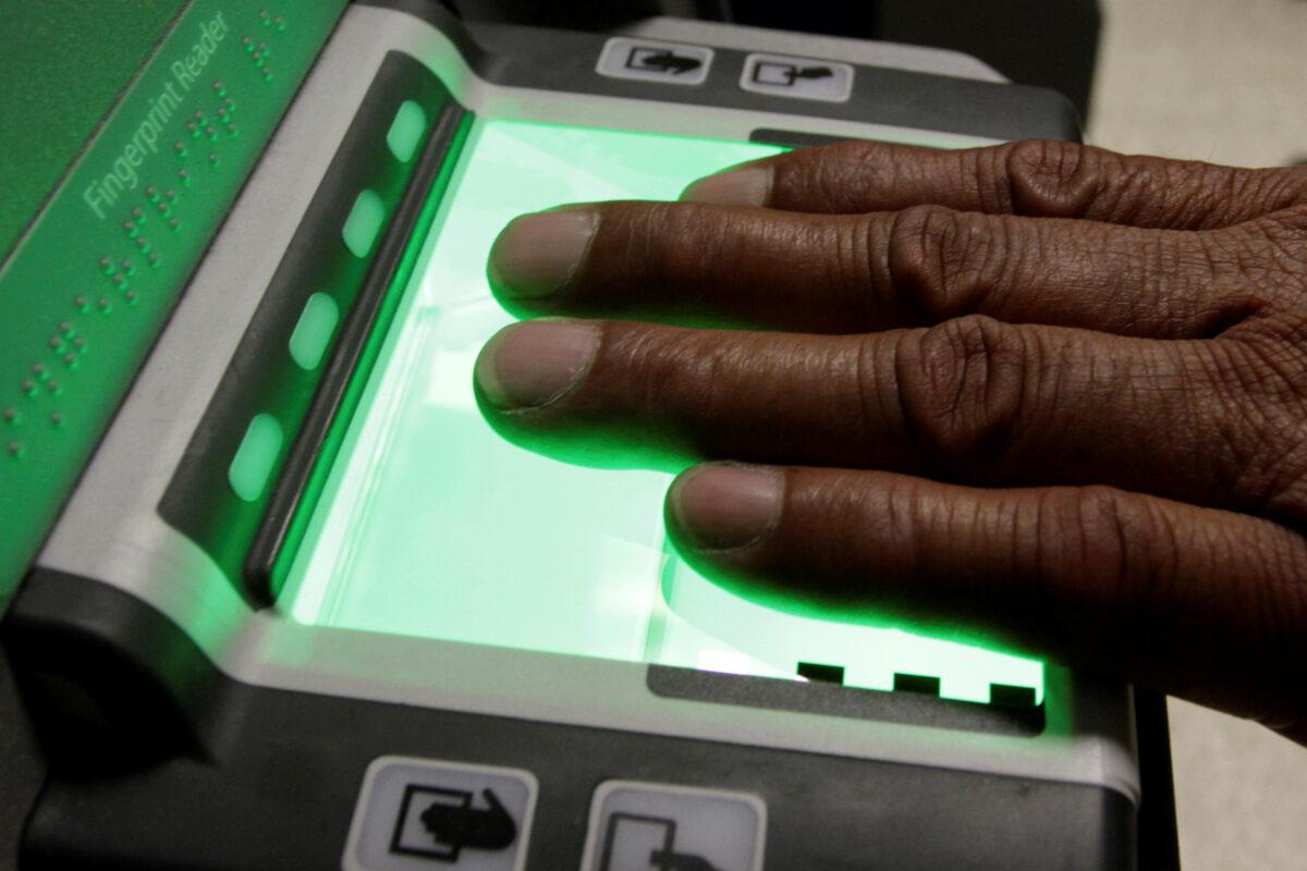 The use of fingerprint reader on a new Global Entry Kiosk is demonstrated at Los Angeles International Airport in a Sept. 7, 2011, file photograph. (Jonathan Alcorn/Reuters)