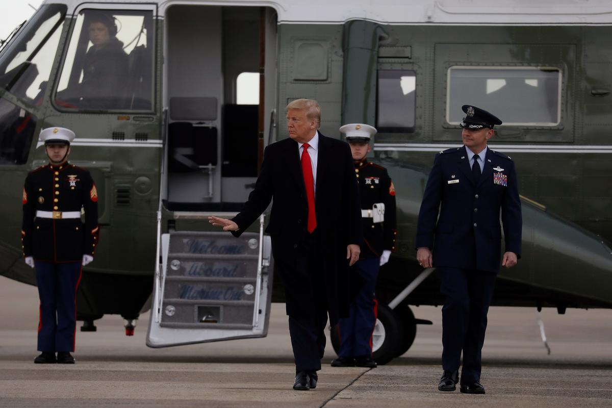President Donald Trump waves as he walks from Marine One as he departs Washington for travel to North Carolina at Joint Base Andrews, Maryland, on Feb. 7, 2020. (Leah Millis/Reuters)