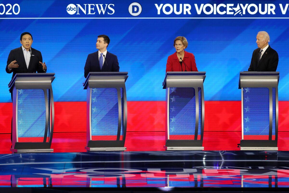 (L-R) Democratic presidential candidates Andrew Yang, former South Bend, Indiana Mayor Pete Buttigieg, Sen. Elizabeth Warren (D-Mass.) and former Vice President Joe Biden at the debate in New Hampshire on Friday night. (Joe Raedle/Getty Images)