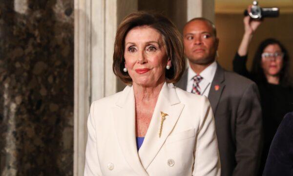 House Speaker Nancy Pelosi (D-Calif.) walks through Statuary Hall to the House Chamber for President Donald Trump's State of the Union address in the Capitol in Washington on Feb. 4, 2020. (Charlotte Cuthbertson/The Epoch Times)