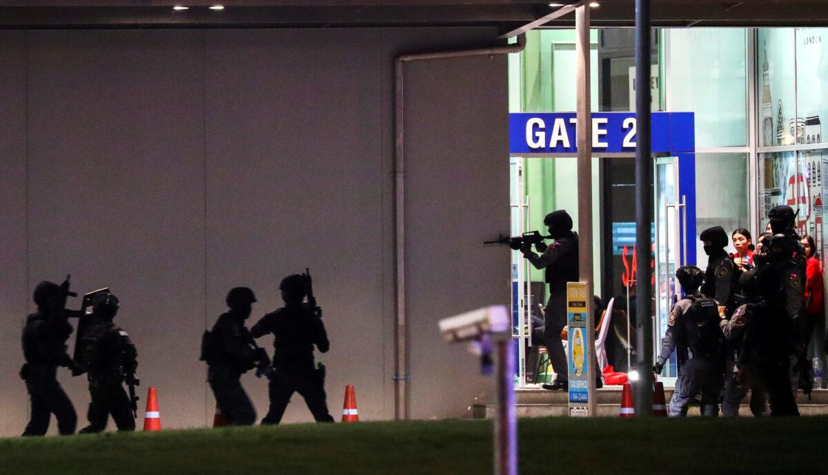Thailand security forces enter in a shopping mall as they chase a shooter hidden in after a mass shooting in front of the Terminal 21, in Nakhon Ratchasima, Thailand, on Feb 9, 2020. (Athit Perawongmetha/Reuters)