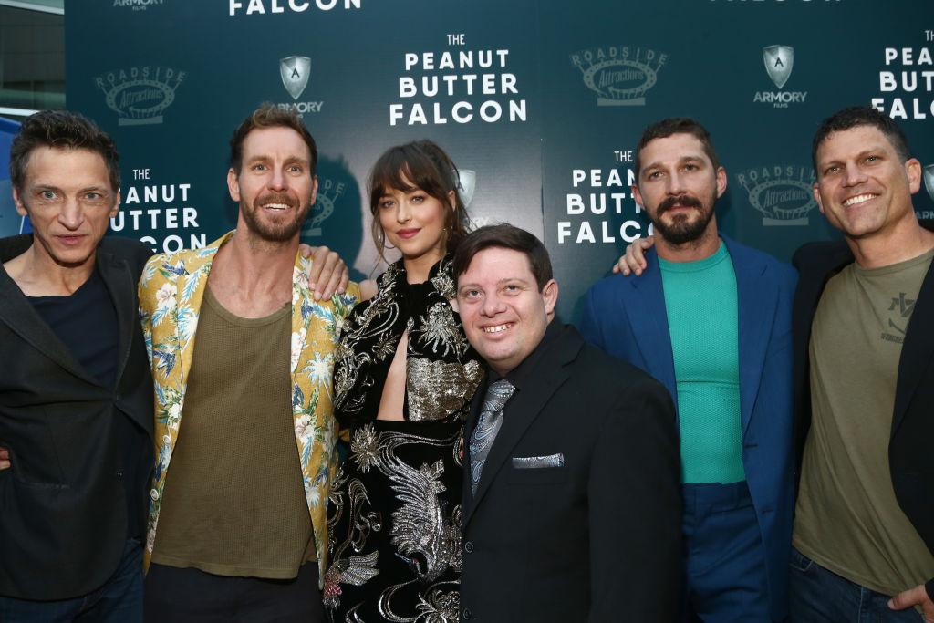 (L–R) John Hawkes, Tyler Nilson, Dakota Johnson, Zack Gottsagen, Shia LaBeouf, and Mike Schwartz at the L.A. screening of 'The Peanut Butter Falcon' at ArcLight Hollywood, California, on Aug. 1, 2019 (©Getty Images | <a href="https://www.gettyimages.com/detail/news-photo/john-hawkes-tyler-nilson-dakota-johnson-zack-gottsagen-and-news-photo/1165636013?adppopup=true">Tommaso Boddi</a>)