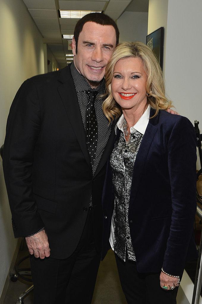 Travolta and Newton-John attend SiriusXM's Town Hall hosted by Didi Conn in New York City on Dec. 12, 2012 (©Getty Images | <a href="https://www.gettyimages.com/detail/news-photo/john-travolta-and-olivia-newton-john-attend-siriusxms-town-news-photo/158280073?adppopup=true">Mike Coppola</a>)