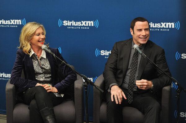 Olivia Newton-John and John Travolta answer questions at SiriusXM's Town Hall with John Travolta and Olivia Newton-John hosted by Didi Conn at the SiriusXM studios in New York City on Dec. 12, 2012. (Mike Coppola/Getty Images for SiriusXM)