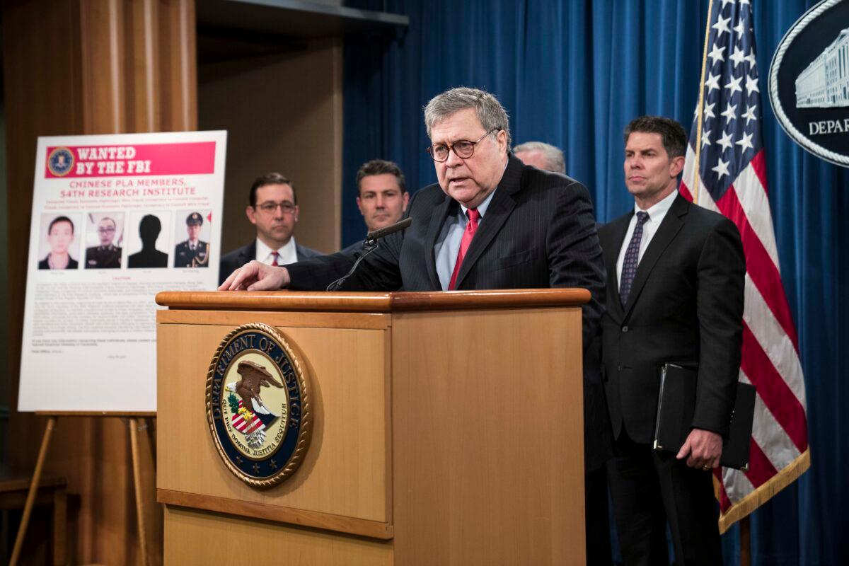 Attorney General William Barr participates in a press conference at the Department of Justice along with DOJ officials in Washington, on Feb. 10, 2020. (Sarah Silbiger/Getty Images)