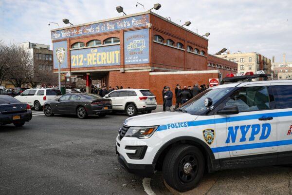 New York City police officers work the scene of a police-involved shooting outside the 41st precinct on Feb. 9, 2020, in New York. (John Minchillo/AP Photo)