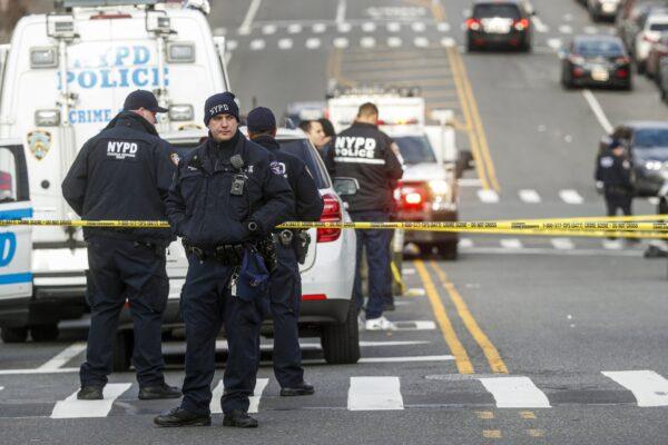 New York City police officers work the scene of a police involved shooting outside the 41st precinct in New York on Feb. 9, 2020. (John Minchillo/AP Photo)