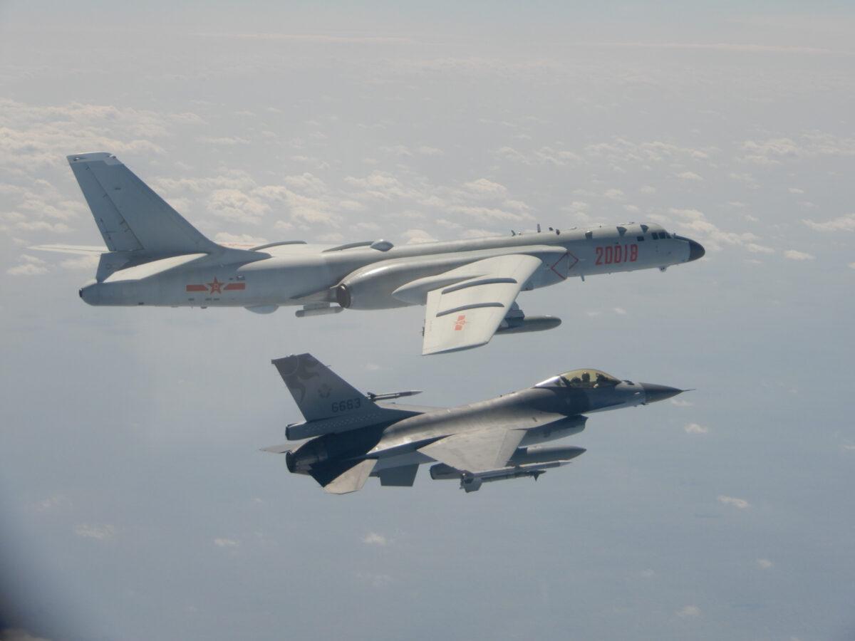An H-6 bomber of the Chinese PLA Air Force flies near a Taiwan F-16 in this handout photo provided by the Taiwan Ministry of National Defense on Feb. 10, 2020. (Taiwan Ministry of National Defense/Handout via Reuters)