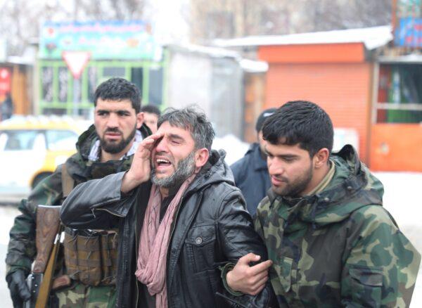 An Afghan man reacts near the site of a suicide attack in Kabul, Afghanistan, on Feb. 11, 2020. (Omar Sobhani/Reuters)