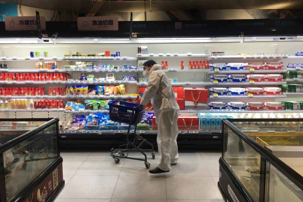 A customer pushes a cart while shopping inside a supermarket of Alibaba's Hema Fresh chain, following an outbreak of the novel coronavirus in Wuhan, Hubei province, China on Feb. 11, 2020. (Stringer/Reuters)