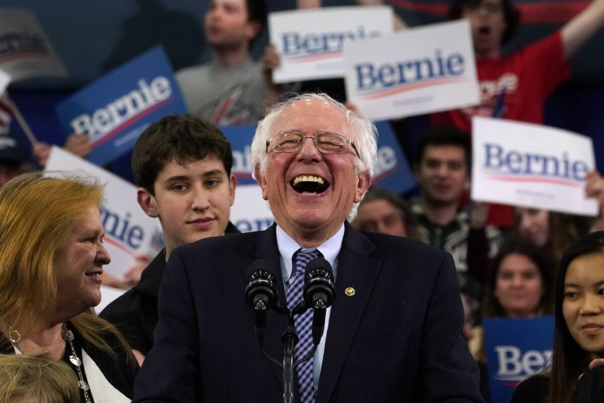 Democratic presidential hopeful Sen. Bernie Sanders of Vermont speaks at a primary night event at the SNHU Field House in Manchester, N.H., on Feb. 11, 2020. (Timothy A. Clary/AFP via Getty Images)
